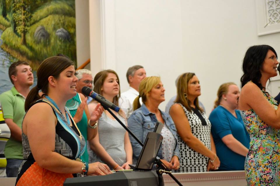 Praise team and choir leading worship
